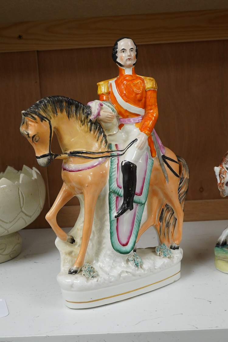 Three Staffordshire flatback figures of Garibaldi, mid 19th century, largest 29cm high